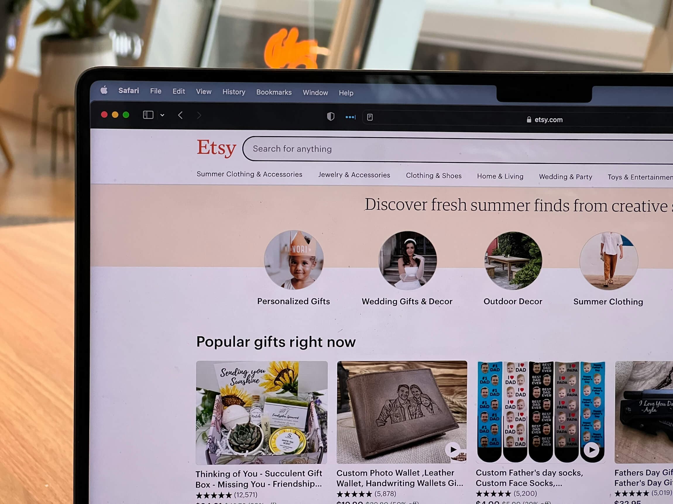A laptop computer displaying an Etsy landing page